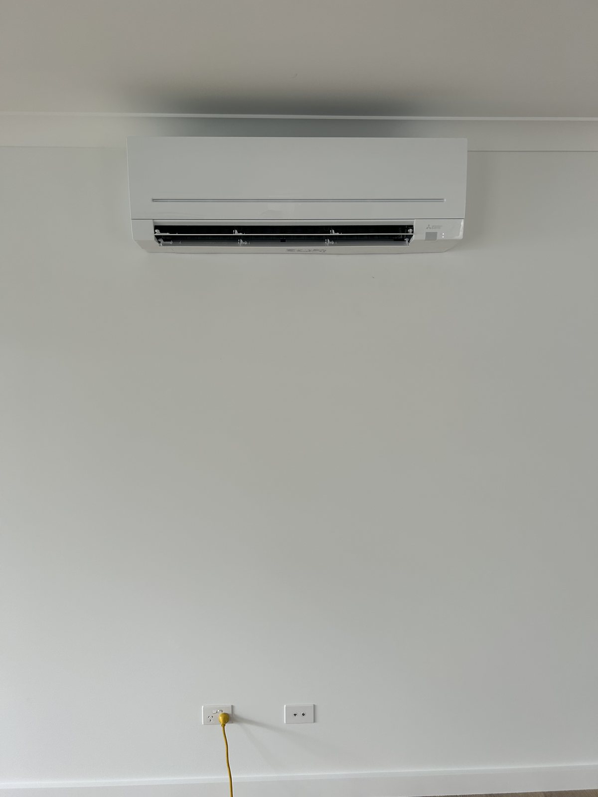 Mitsubishi Electric split system head unit installed on an interior wall in Grafton NSW